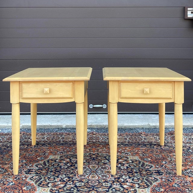 A pair of late 20th century Ethan Allen American Dimensions collection Contemporary maple side tables, each having one...