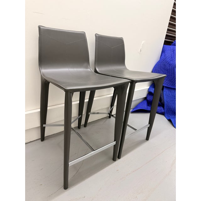 Pair of Holly Hunt Adriatic Counter Stools The Adriatic counter stool has a graceful shape and slender tapered legs,...