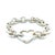 A rare Tiffany & Co. bracelet crafted in sterling silver, featuring a classic round link chain with the distinctive heart-...