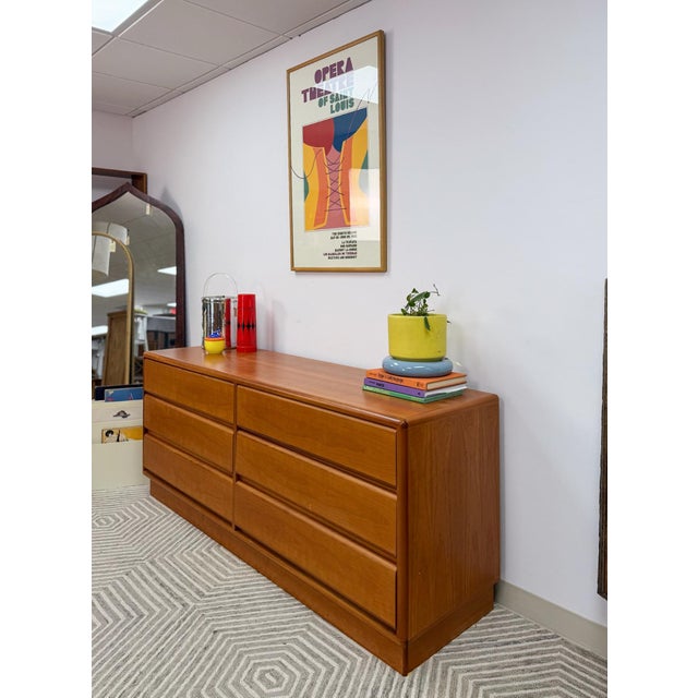 Elevate your space with this stunning authentic, Danish teak 6-drawer dresser by Mobican, a piece that perfectly blends...