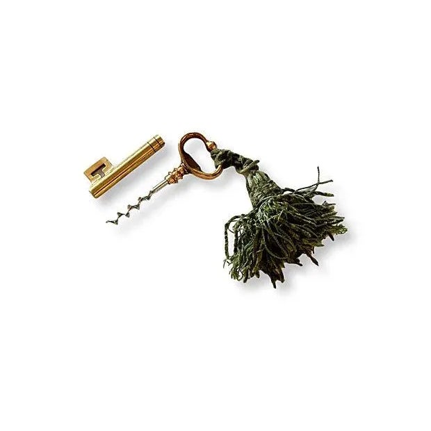 Antique wine corkscrew concealed into a faux skeleton key. Antique French tassel included. No maker's mark.