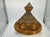 A beautifully detailed vintage Moroccan tagine featuring an elegant ceramic form embellished with an intricate silver-tone...