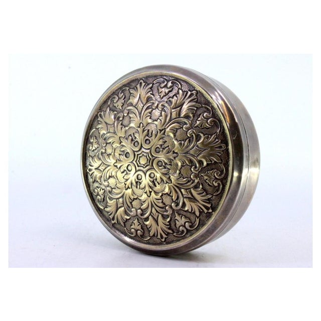 Circular Silver Box with Floral Reliefs, in Very Good conditions. Designed 1920 to 1949 This piece has an attribution...