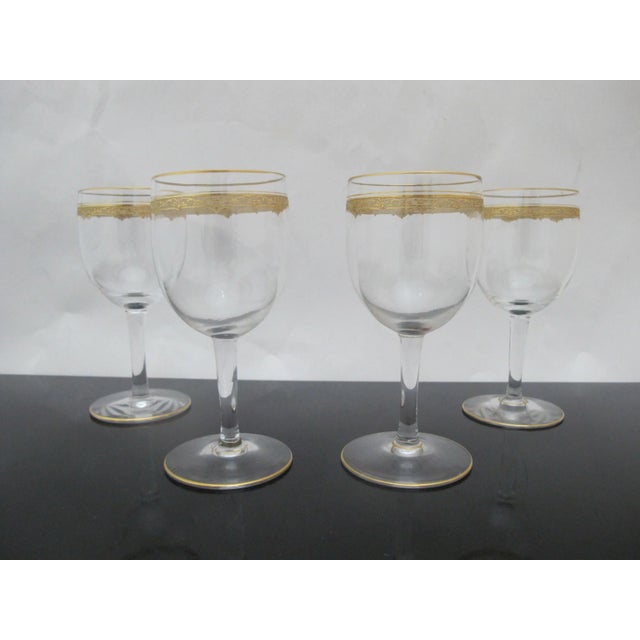 Exquisite port wine glass set of 4. Clear crystal with gold gilt accent at rim and base. Similar to St. Louis in style and...