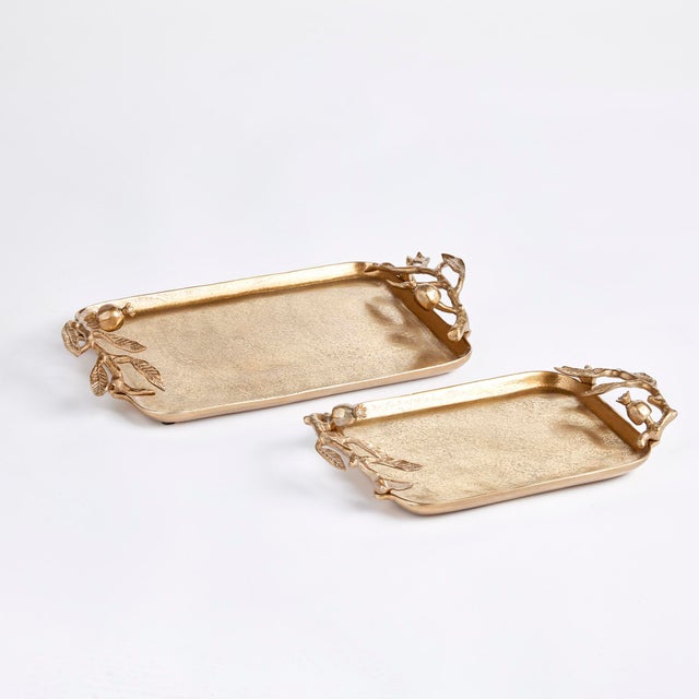 Made of a solid cast aluminum, these trays are adorned with traditional pomegranate designs on the handles. Finished in a...