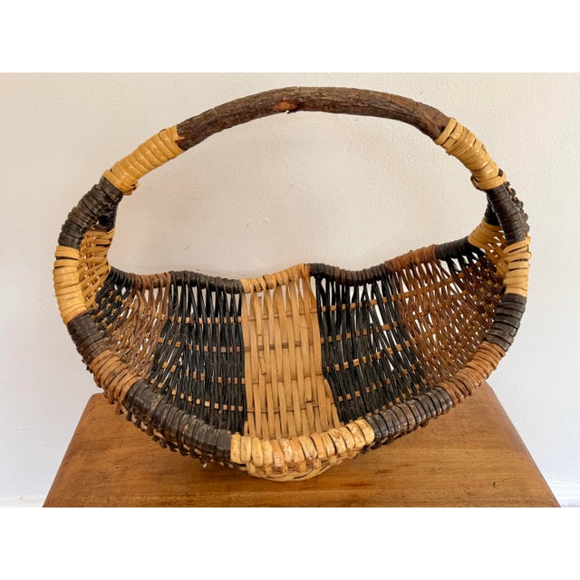 Absolutely gorgeous tricolored folk art basket with a beautiful twisted vine structure and wicker body. Rustic and...