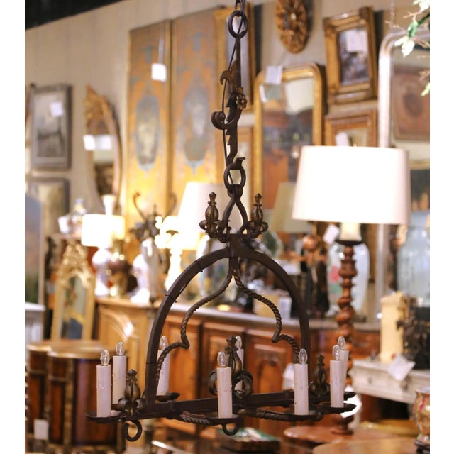 This impressive antique chandelier was crafted in France circa 1880. Forged from heavy wrought iron, the eight-light...