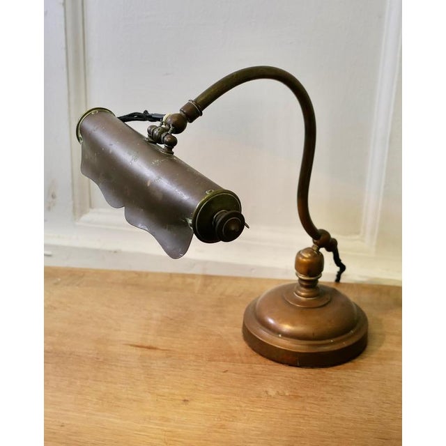 Brass Art Nouveau Adjustable Library Lamp This is a very unusual piece, the lamp has a round brass base which supports the...