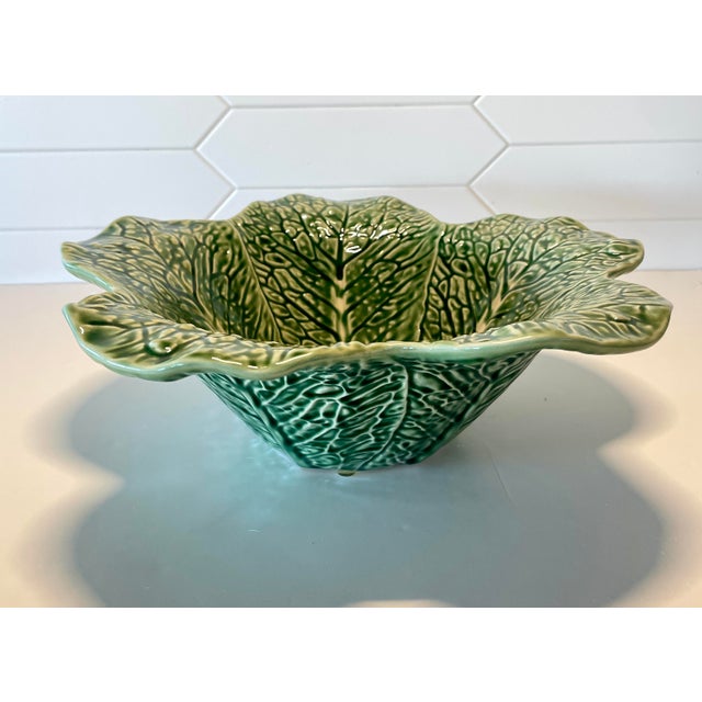 Deep bowl cabbage ware serving piece with highly accentuated leaves by famous Portuguese maker. Measures 13"W x 13"D x...
