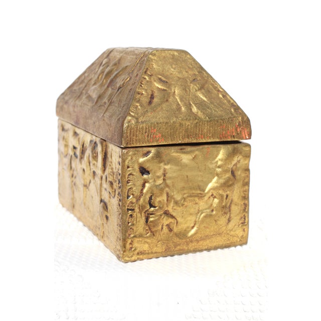 A very unique gold box in aged gild with a removeable top. Casket or Reliquary box style. Reproduction of a medieval...