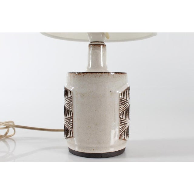 Medium size ceramic table lamp made by the ceramic workshop Stogo in Denmark circa 1960s. The lamp base is partly glazed...