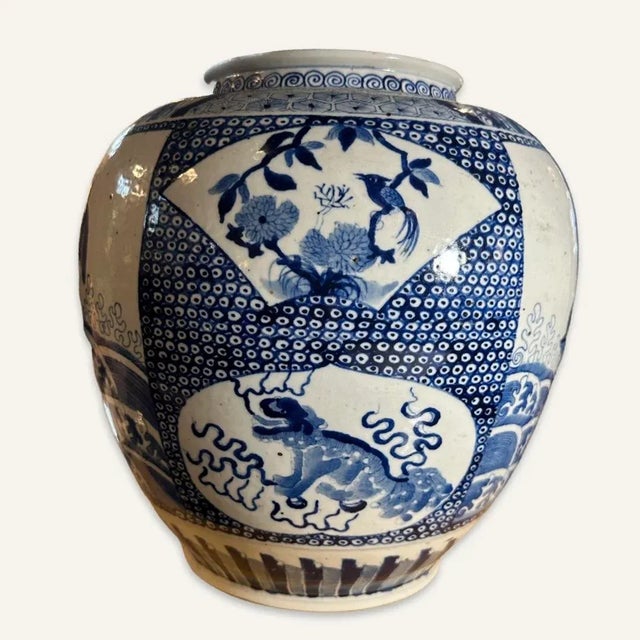 This Chinese blue and white porcelain jar is decorated with panels and cartouches depicting Chinese guardian lions, waves...