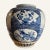 This Chinese blue and white porcelain jar is decorated with panels and cartouches depicting Chinese guardian lions, waves...