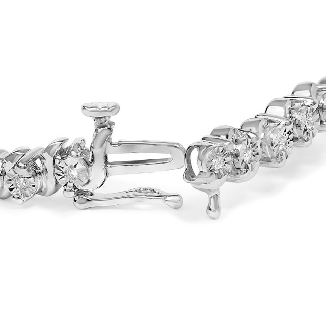 This exquisite bracelet intertwines timeless elegance with modern luxury, crafted in .925 sterling silver and adorned with...