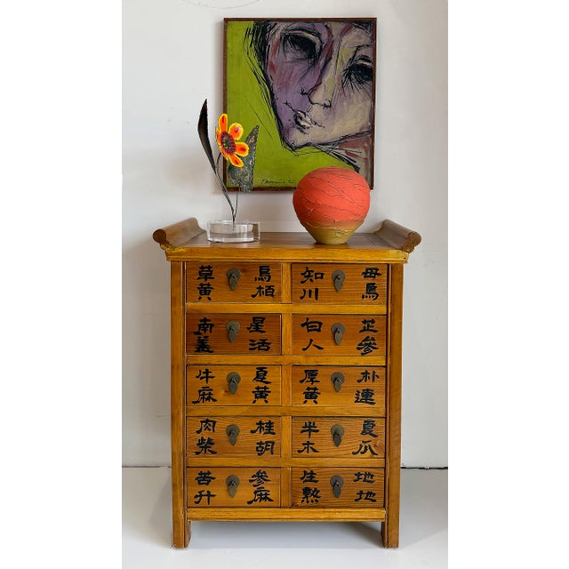 Vintage Chinese Apothecary Cabinet, Painted Calligraphy, 10 Drawers Offered for sale is a vintage Chinese apothecary...