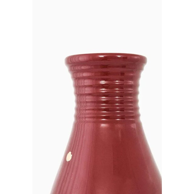 Glazed ceramic floor vase designed by Ewald Dahlskog. Produced by Bobergs Fajansfabrik in Sweden. Wear consistent with age...