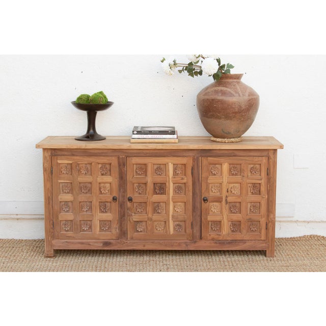 This 66-inch sideboard brings the rhythmic majesty of Indian architecture to a versatile, mid-scale silhouette. The...