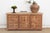 This 66-inch sideboard brings the rhythmic majesty of Indian architecture to a versatile, mid-scale silhouette. The...