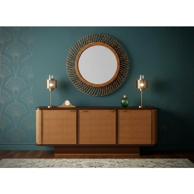 Round bamboo and rattan mirror designed by Dutch designer Olaf Von Bohr. Elegant and versatile, the mirror has a very...