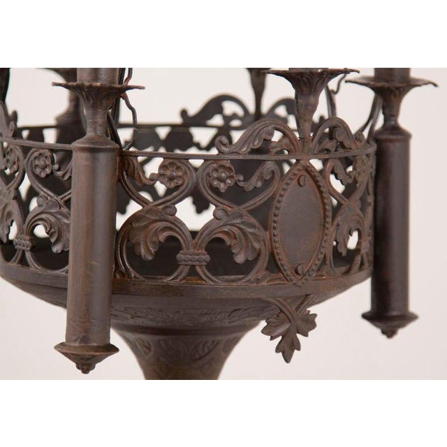 A nice and decorative Gothic Revival chandelier / pendant. Condition: Metal frame with candles in antique brass and was...