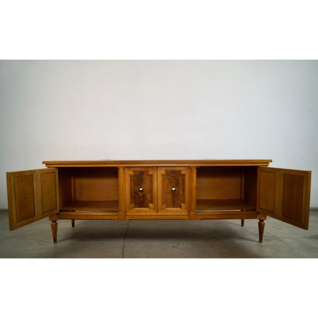 Vintage 1960's Hollywood Regency console table cabinet/ credenza cabinet for sale. It was manufactured by American of...