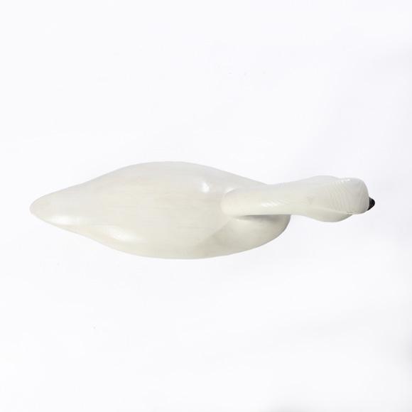 A carved Swan decoy sculpture by Bill Schneck 1990. Signed on the bottom.