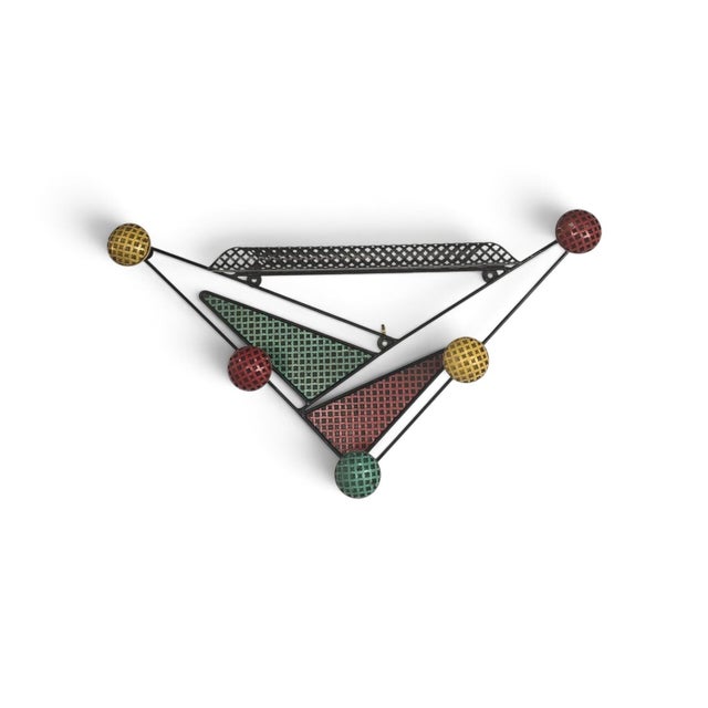 French Wall-Mounted Coat Rack by Mathieu Matégot, 1950s, in Good conditions. Designed 1950 to 1959 This piece is...