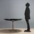 Table with extendable top, features a chromed metal base and the top is made of exotic wood veneer. Good condition. This...