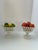 Two closely coordinated white glazed compotes with flared, pierced lattice bowls, scalloped rims, and stepped pedestal...