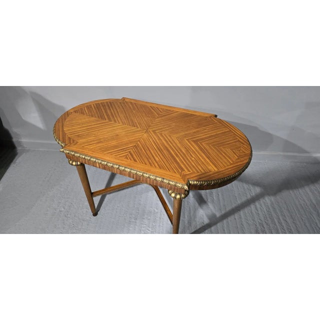 A super quality satinwood and parcel gilded coffee table, excellent colour and overall great condition. 24" high 44" wide...