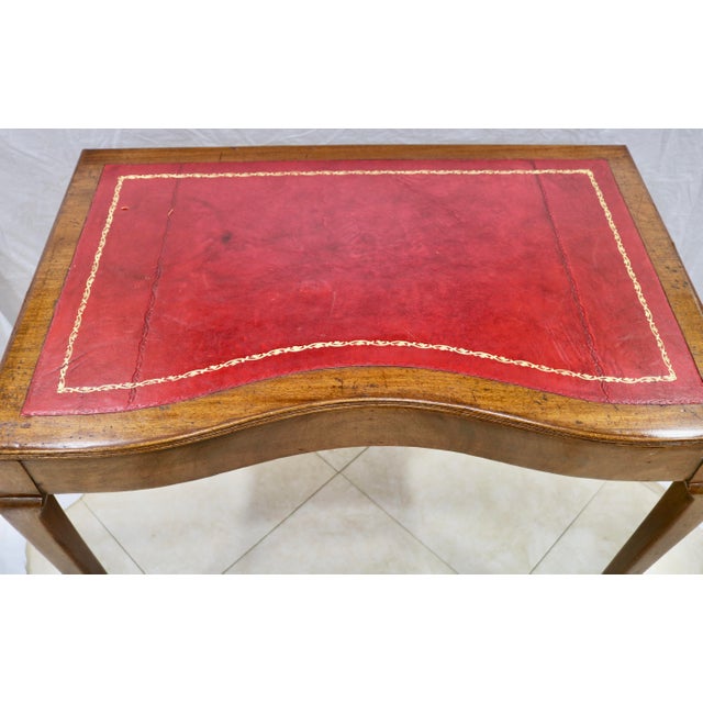Gilt Leather Top Desk. There is one small area of damage which is shown in a close up photo. Otherwise the desk is in...