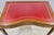 Gilt Leather Top Desk. There is one small area of damage which is shown in a close up photo. Otherwise the desk is in...