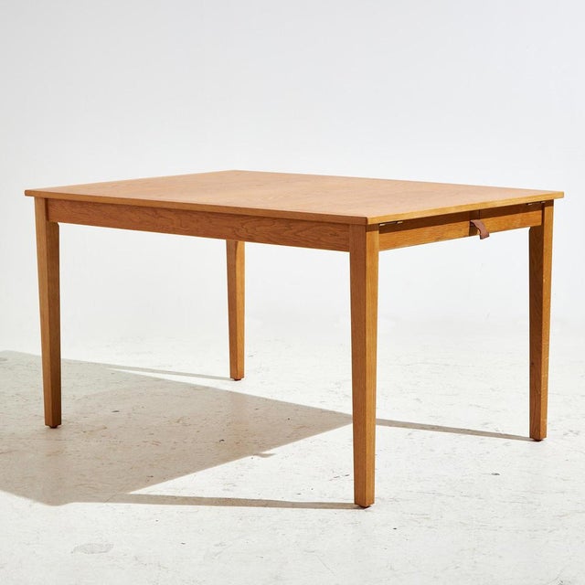 Oak dining table with two extension pieces from the 1960s designed by Kai Winding for Slagelse Møbelværk. The wooden parts...