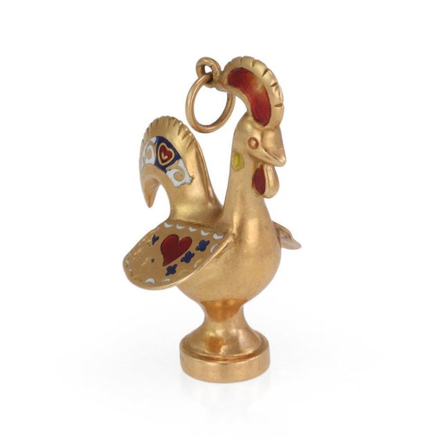This is a charming vintage pendant. It is crafted from 18k yellow gold featuring a 3D full figure rooster with white red...