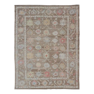 Turkish Oushak Rug With All-Over Floral Design on a Light Brown Field For Sale