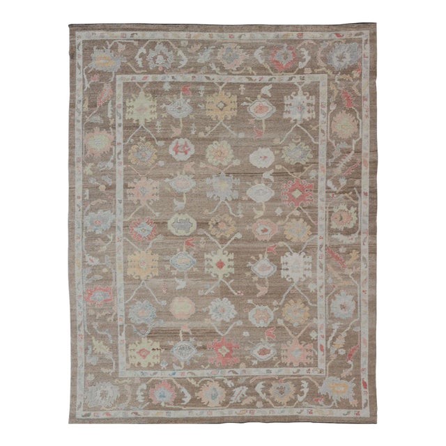 Turkish Oushak Rug With All-Over Floral Design on a Light Brown Field For Sale