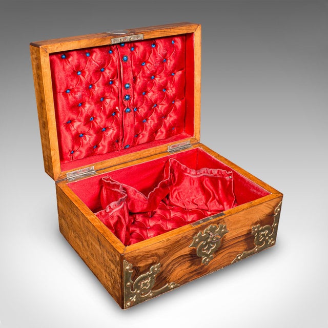 This is an antique Gothic revival sewing case. A Scottish, walnut and brass work box, dating to the Victorian period,...