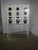 Metal container for dispensing coffee beans. with two measuring cups (the third is missing), three dispensers, three round...