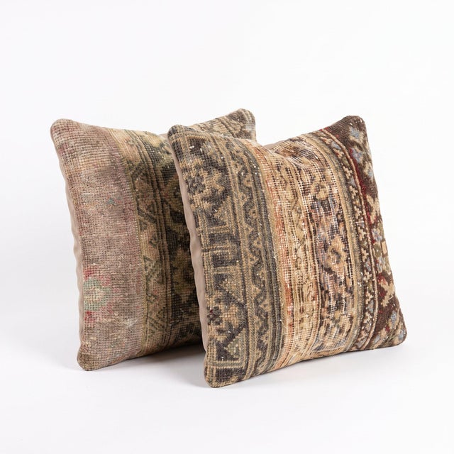 This 20'' x 20'' pillow cover set was made from authentic Turkish rug pieces — muted Turkish border stripes in dusty pink...