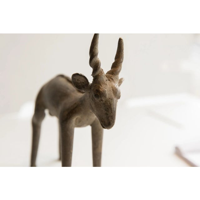 :: Vintage handmade African antelope sculpture. Circa late mid 20th century, though possibly older, this piece has such...