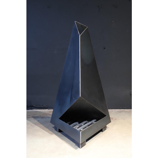 Not your normal chiminea or fireplace. This high design, raw steel sculptural piece will make a statement in any outdoor...