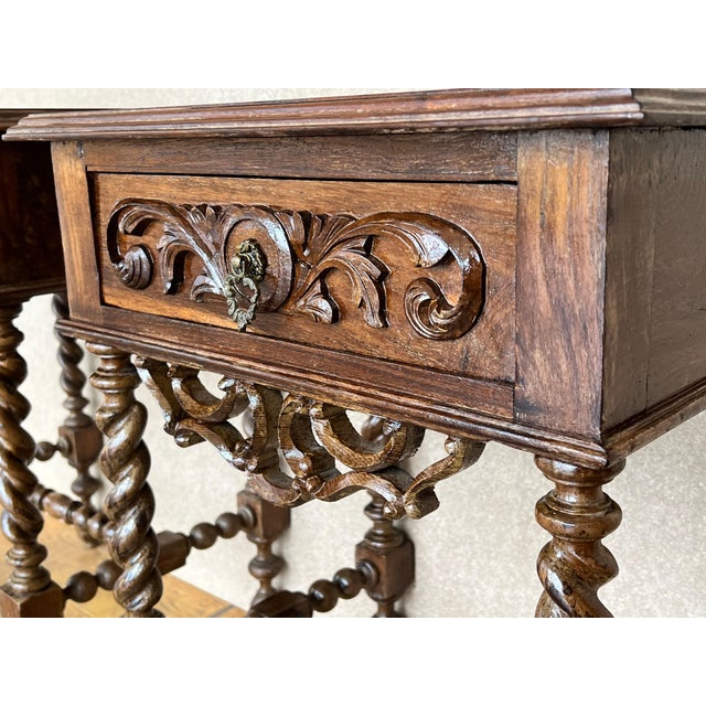 20th Century pair of solid carved French nightstands with turned columns and stretcher. It has one carved drawer with...