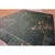 An authentic 1930s Chinese Art Deco wool carpet featuring a solid green field and matching green border. Hand-knotted with...