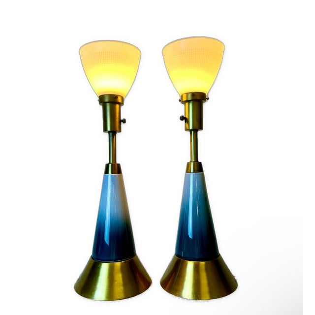 Transform your living space with this stunning pair of Mid-Century glazed pottery and solid brass table lamps. A perfect...