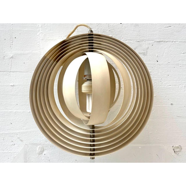 The iconic Moon pendant lamp by Danish designer Verner Panton, designed around 1960 and produced by Louis Poulsen, is...