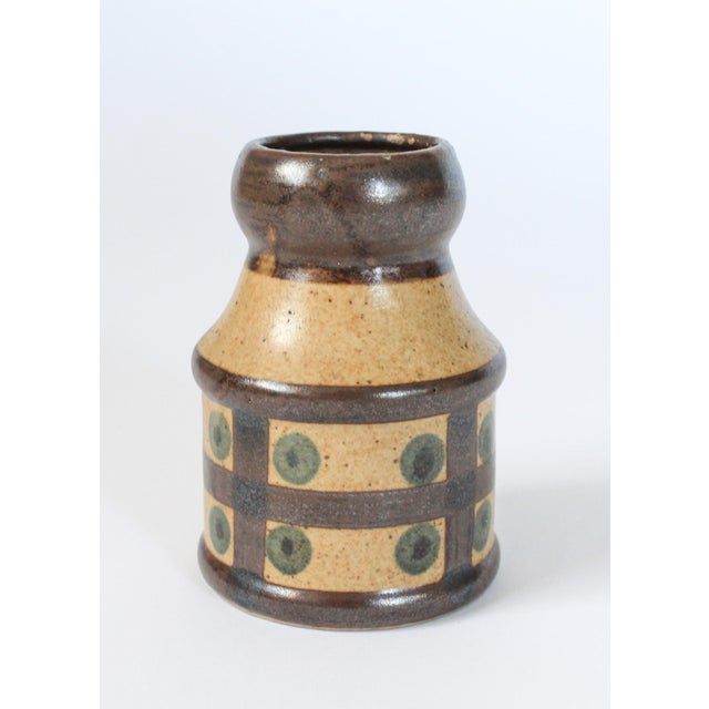 Mid-century modern pottery vase with polka dots. No makers mark. Some light wear to painted rim. Pictured. No chips or...