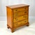 This Chippendale-style chest of drawers by Kittinger Furniture (Model #733) is crafted from knotty pine with a warm amber...