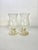 Pair of French candle holders from the 1970s, made of clear, bubbled glass. Each piece has a beautifully curved and...