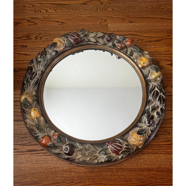 Beautiful vintage round wall mirror by La Barge featuring a hand-carved and hand-painted wood frame richly adorned with...