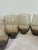 A set of six Libbey “Tempo” smoked glass mugs from the 1970s, showcasing the warm earth-tone aesthetic that defined the...